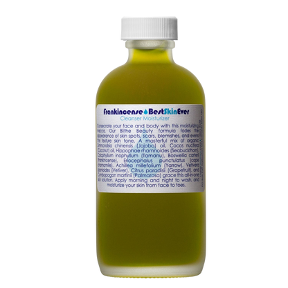 A bottle of "Living Libations Best Skin Ever Cleanser- Frankincense" filled with yellowish liquid. The bottle features a white cap and a label that includes product information, usage instructions, and an ingredient list. Enriched with Frankincense Oil, the text on the label is presented in dark blue and black.
