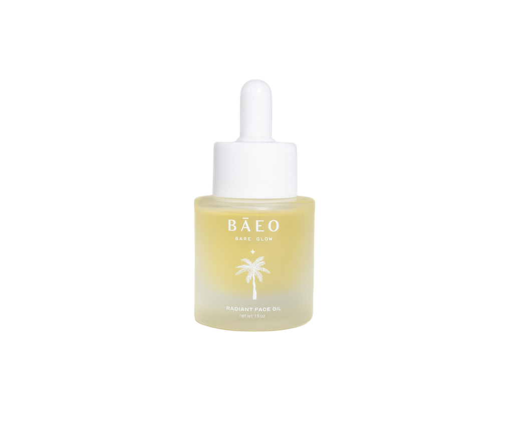 A small bottle of bare glow by Bare Essential Organics features a white dropper cap. The translucent bottle with yellow oil displays a palm tree logo and text on the front. Infused with antioxidants for radiant skin, it stands out against the plain black background.