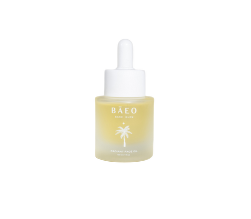 A small bottle of bare glow by Bare Essential Organics features a white dropper cap. The translucent bottle with yellow oil displays a palm tree logo and text on the front. Infused with antioxidants for radiant skin, it stands out against the plain black background.