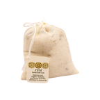 The "rest bath soak" by Honeybee Hippie is a small muslin drawstring bag featuring Dead Sea salt and botanicals like butterfly pea flower, lavender, calendula, and chamomile—a treat for botanical skincare lovers.