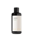 A black bottle labeled "Herbalized Pulling Oil" by Surya, featuring a white label with ayurvedic and tridoshic details, is displayed against a plain white background.