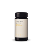 A dark glass jar with a beige label reading "Calming Digestive Spices" by Surya, displayed on a plain white background—ideal for adding depth to vegetables or cooking dahl.