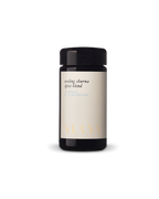 A black jar with a light label reading "Cooling Digestive Spices" from Surya, ayurvedic and pitta balancing, perfect for cooling and cooking dahl, photographed against a plain white background.
