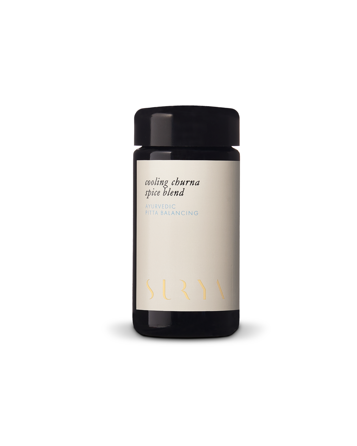 A black jar with a light label reading "Cooling Digestive Spices" from Surya, ayurvedic and pitta balancing, perfect for cooling and cooking dahl, photographed against a plain white background.