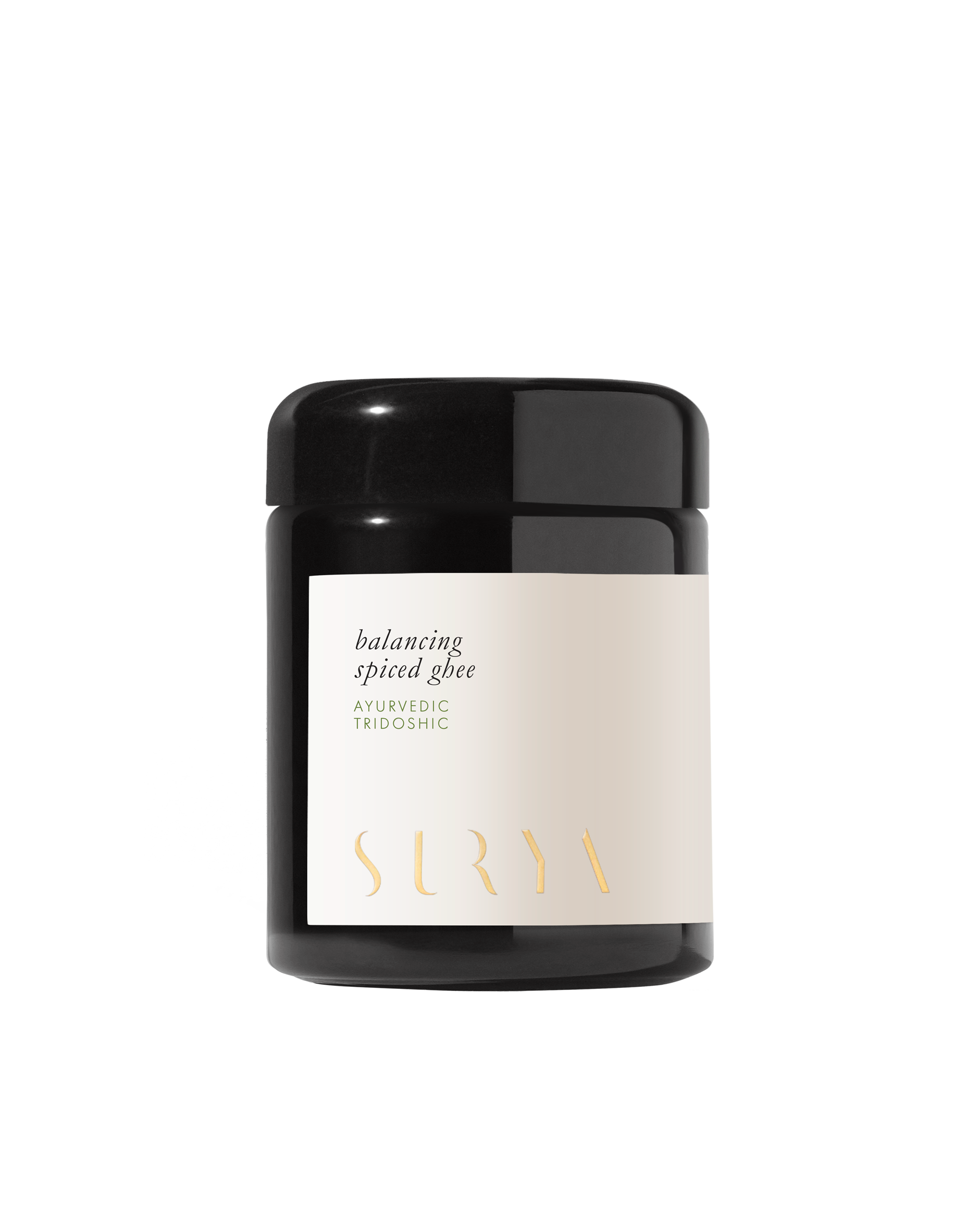 A black jar labeled "Surya Spiced Ghee, Ayurvedic Tridoshic" rests on a white background—ideal for Ayurvedic cooking with nourishing organic ghee.