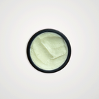A black-rimmed jar of Wild Mamas Earth, Whipped & Sky 3.16oz—Wild Bison Tallow Balm (Whipped) is shown from above, revealing its smooth, pale balm and highlighting regenerative organic skincare on a clean white background.