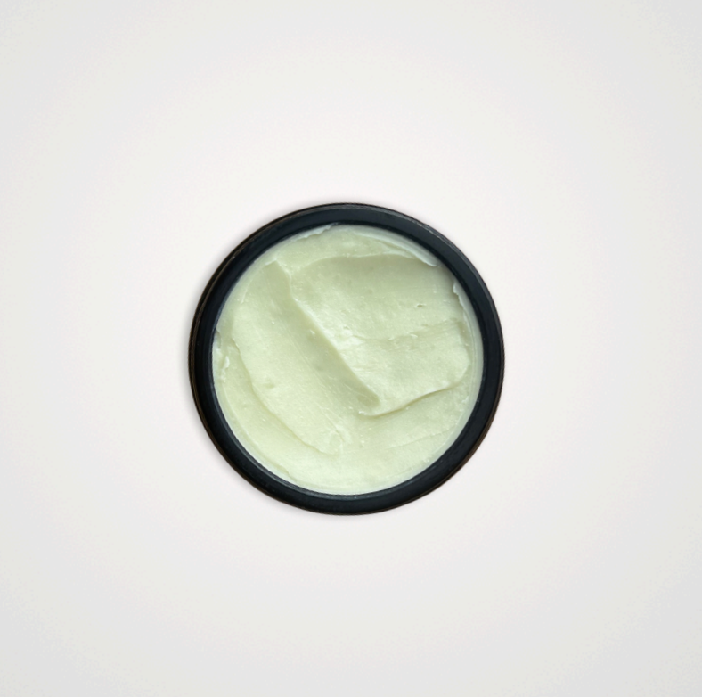 A black-rimmed jar of Wild Mamas Earth, Whipped & Sky 3.16oz—Wild Bison Tallow Balm (Whipped) is shown from above, revealing its smooth, pale balm and highlighting regenerative organic skincare on a clean white background.