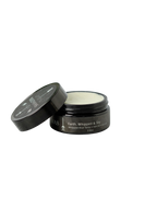An open jar of Wild Mamas Earth, Whipped & Sky 3.16oz Wild Bison Tallow Balm (Whipped) sits with its lid beside it, against a plain white background—ideal for rosacea-prone skin.