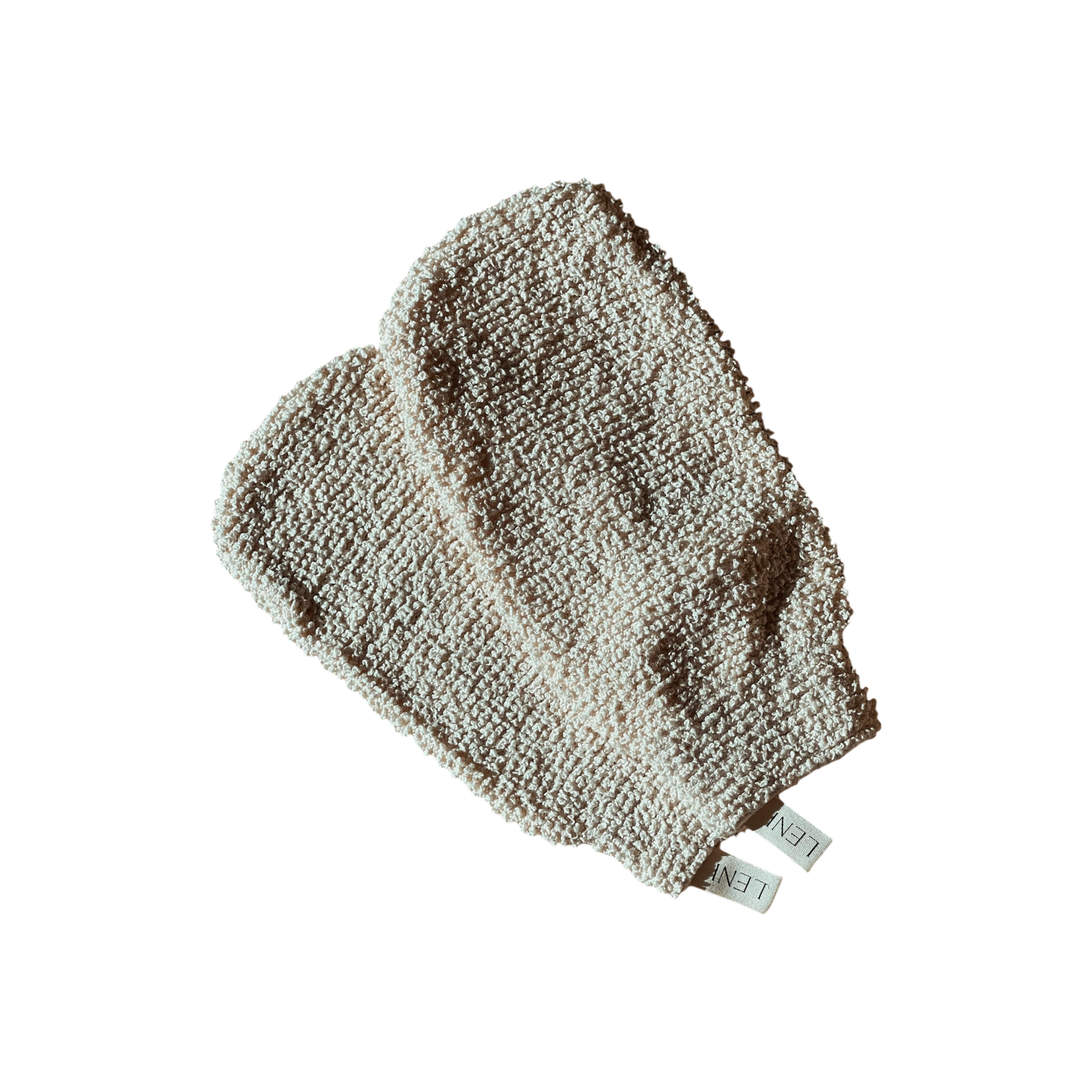 A pair of cream-colored, textured exfoliating mitts featuring small fabric tags labeled "LENI." Known as The Scrub Mitts, they are ideal for dry scrubbing. The mitts are showcased against a black background.