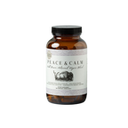 A brown glass bottle with a black screw cap, labeled "Peace and Calm- Wild Bison Adrenal Organ Blend" by Wild Mamas. The white label shows a bison image and product info. Contains 180 capsules of bison adrenal supplement.