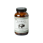 A brown glass bottle labeled “Woman - Wild Bison Ovary Blend” by Wild Mamas features a bison illustration and contains organ meat supplements packed with ancestral nutrition.