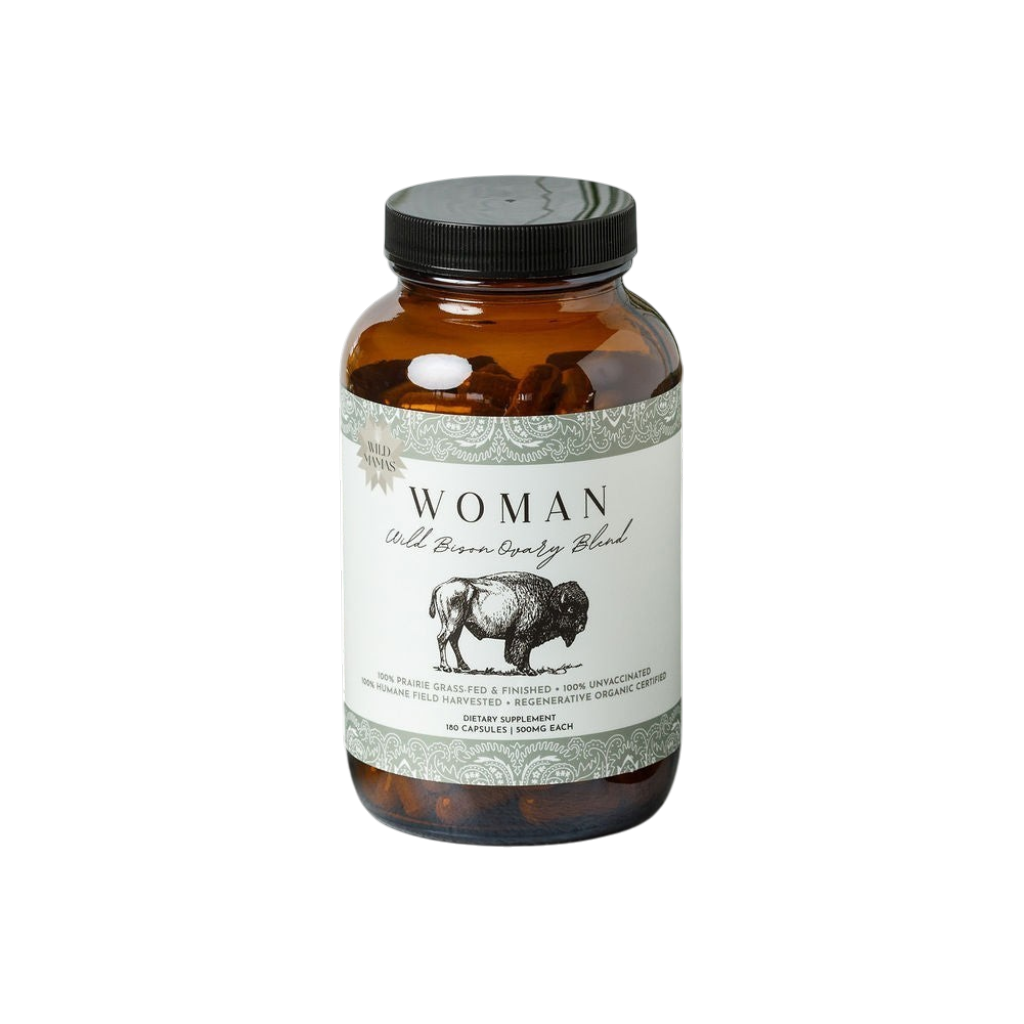A brown glass bottle labeled “Woman - Wild Bison Ovary Blend” by Wild Mamas features a bison illustration and contains organ meat supplements packed with ancestral nutrition.