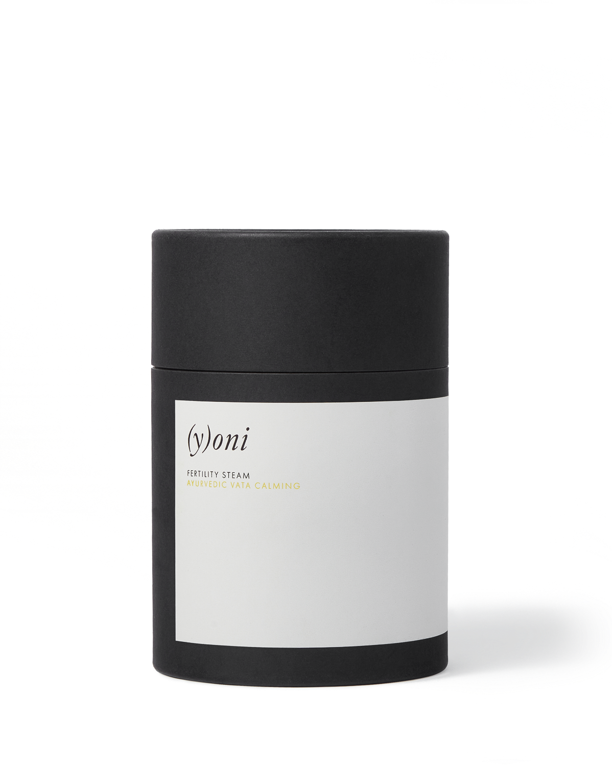 A black cylindrical container with a white label that reads "Surya (y)oni Fertility Steam" in minimalist font, featuring Ayurvedic herbs for yoni fertility steam, set against a plain white background.