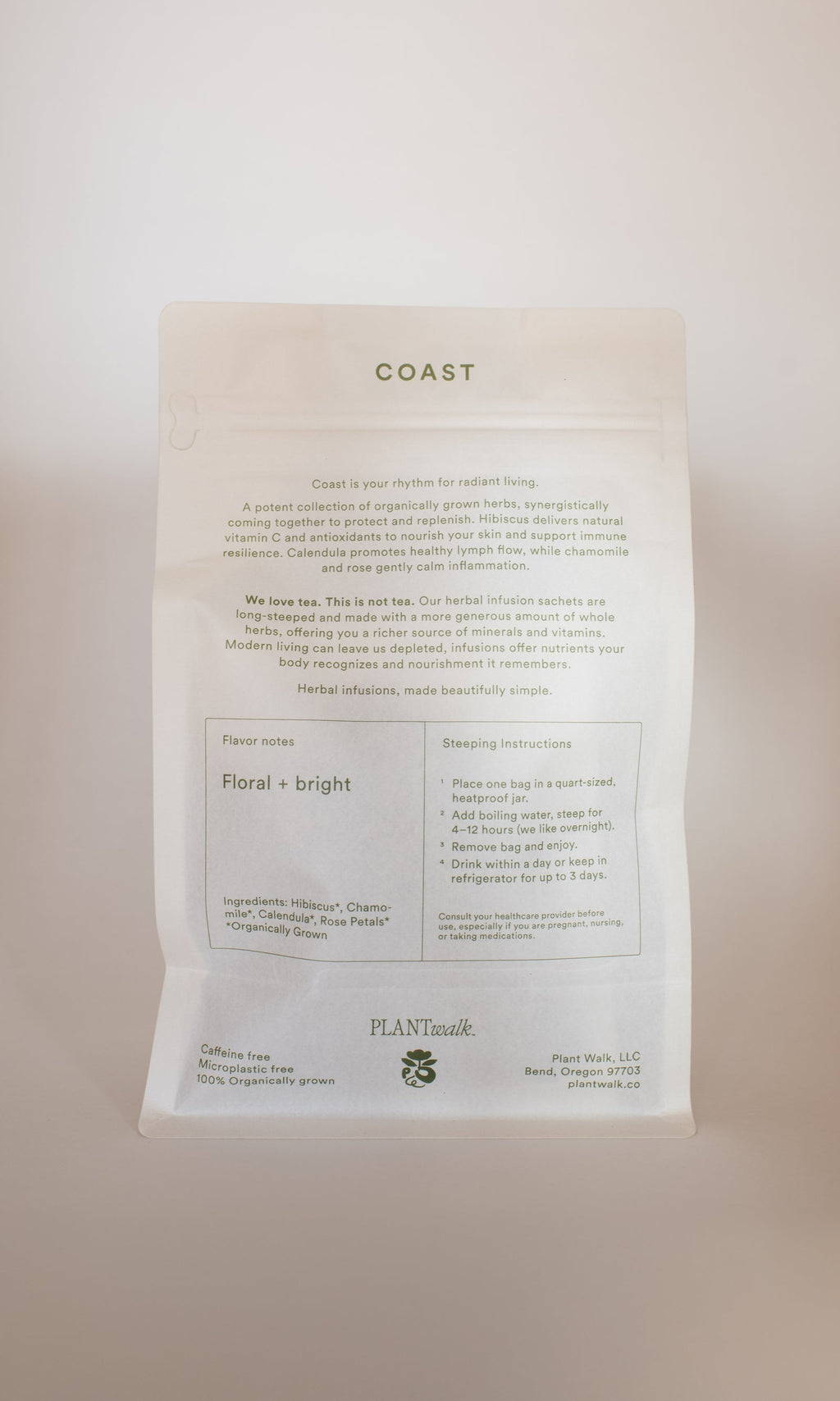 A white tea package labeled "COAST | Antioxidant Protection Herbal Infusion" features flavor notes, steeping instructions, ingredients, and a minimalist design highlighting PLANTWALK branding from Bend, Oregon.