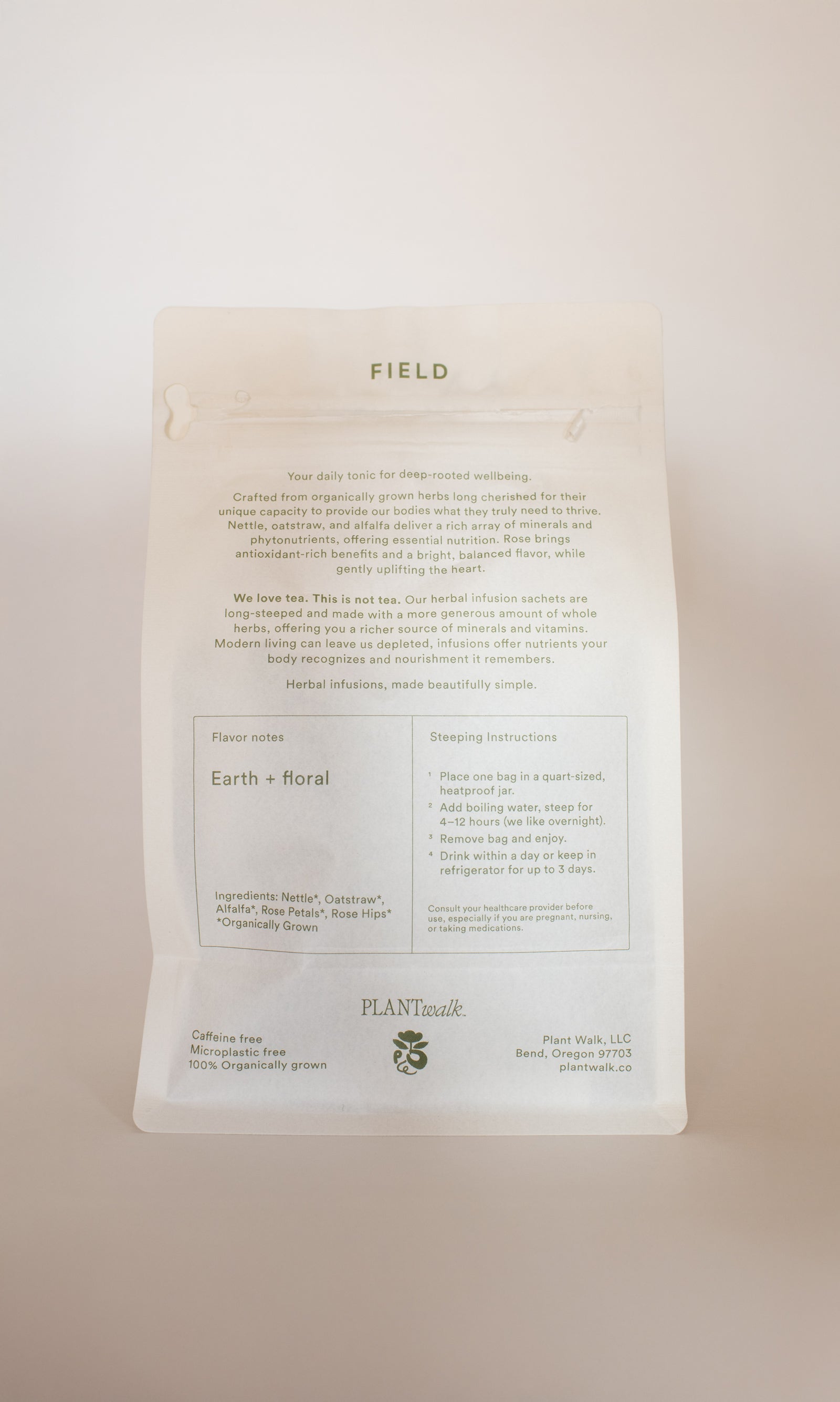 A white, resealable pouch labeled "FIELD | Everyday Minerals Herbal Infusion" by PLANTWALK. The packaging features plant-based minerals, earth and floral flavor notes, mineral-rich water steeping instructions, and soft green brand details.
