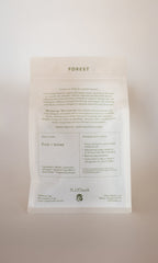 A white tea package labeled "FOREST | Healthy Hair & Skin Herbal Infusion" by PLANTWALK features text on fruit and honey notes, silica for hair and nail strength, steeping instructions, and stands upright against a light background.