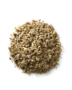 Surya (y)oni Reset Steam is a blend of dried, chopped Ayurvedic herbs and plant materials in earthy brown, green, and beige tones, traditionally used to support reproductive health. Shown here against a plain white background.