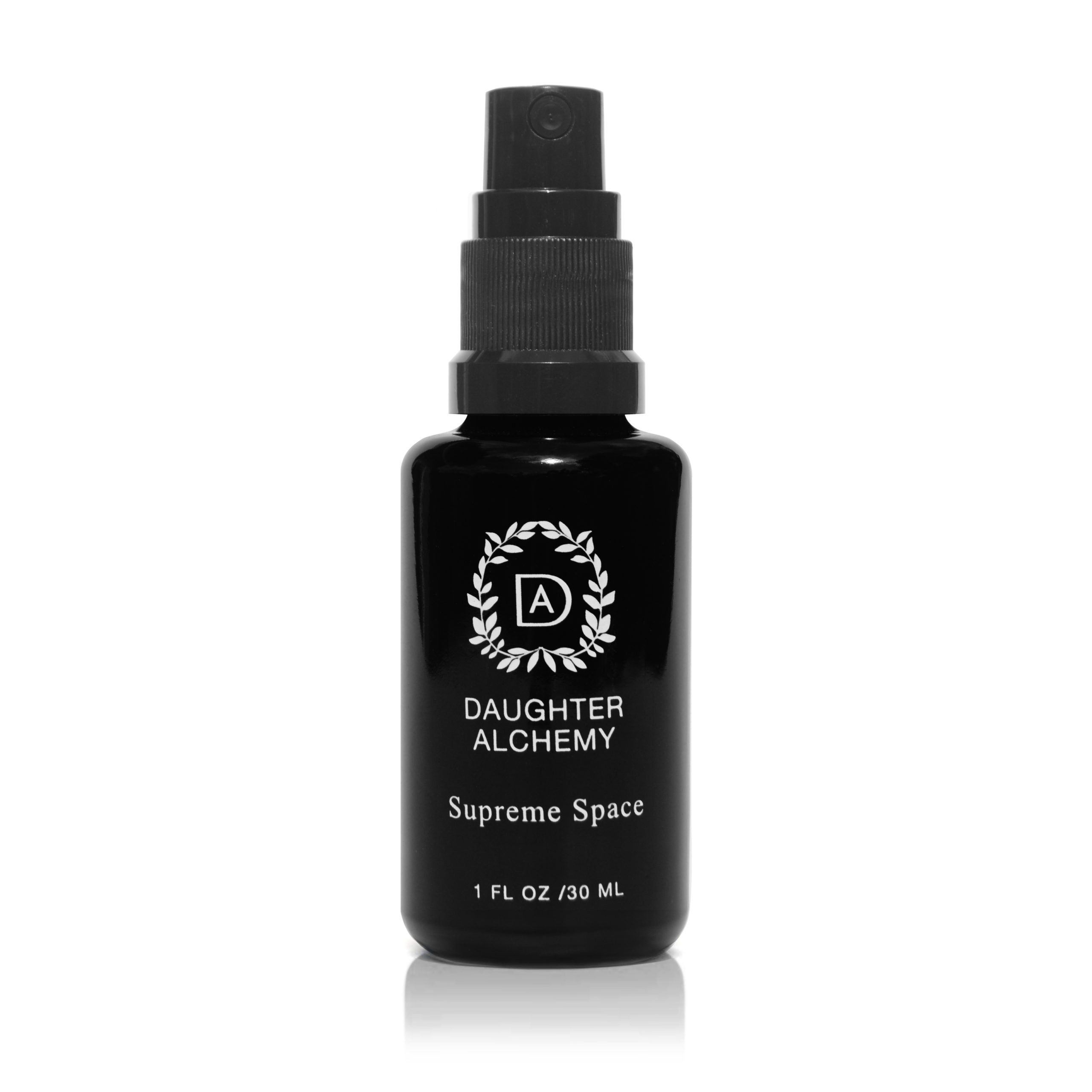 A black spray bottle labeled "Daughter Alchemy Supreme Space® Botanical Protective Spray," featuring a white decorative logo and containing 1 fl oz (30 ml) of organic room spray for grounding and cleansing, set on a plain white background.