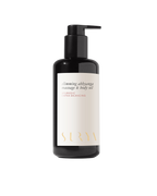 A black pump bottle labeled "Slimming Massage Oil" by Surya features gold text on a white background—a luxurious Ayurvedic body oil ideal for slimming massages.