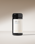 A black cylindrical jar labeled "Cooling Digestive Spices" by Surya sits on a neutral gradient background with a soft shadow, perfect for adding Ayurvedic Pitta-balancing flavor to dahl and other dishes.