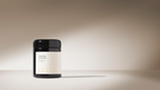 A dark jar with a white label reading "Spiced Ghee" and "Surya" sits on a smooth surface, evoking the purity of organic ghee used in Ayurvedic cooking, against a neutral beige gradient with soft shadows.