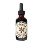 A brown glass dropper bottle labeled "Tranquility Tonic" by WOODEN SPOON HERBS, featuring a plant graphic, black dropper cap, and crafted with organic herbs for natural stress relief.