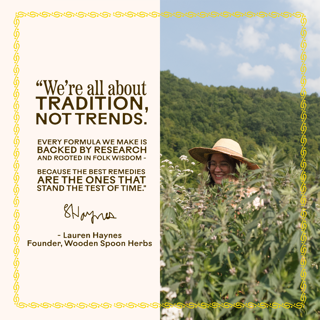 A woman in a straw hat smiles in a green herb field with tall plants, hills, and trees behind her. Beside her, a quote highlights tradition and the calming herbal blend of Tranquility Tonic by WOODEN SPOON HERBS.