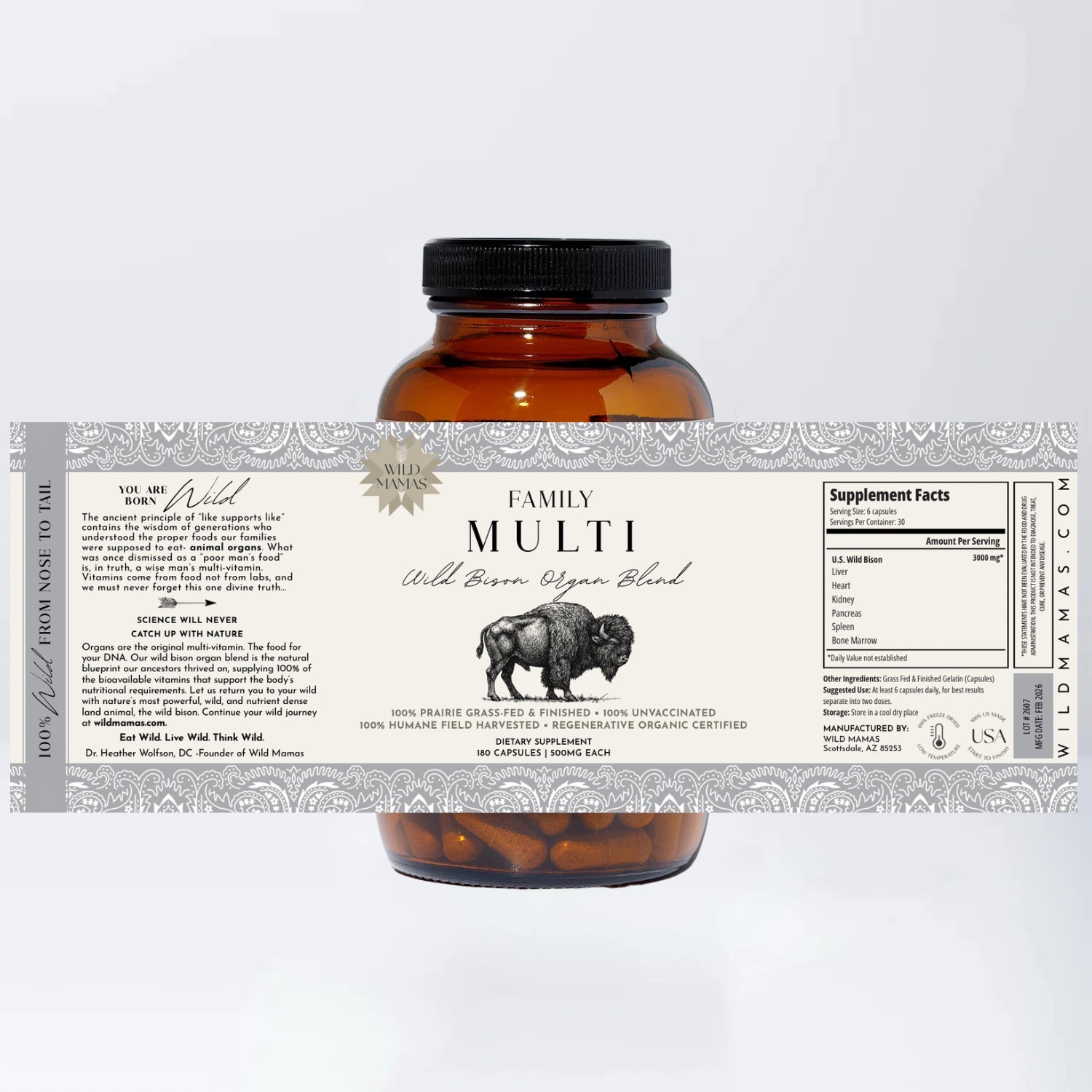 Amber bottle containing brown capsules, labeled "Family Multi-Wild Bison Organ Blend" by Wild Mamas. This whole food multivitamin features supplement facts for pasture-raised, prairie grass-fed wild bison organ and liver blend.