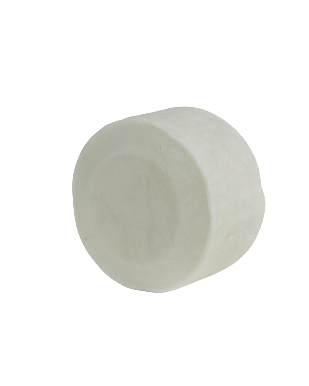A single large white bare bar by bāeo rests on a plain white background, its smooth surface hinting at a gentle cleansing shampoo and body wash bar crafted from plant-based oils.