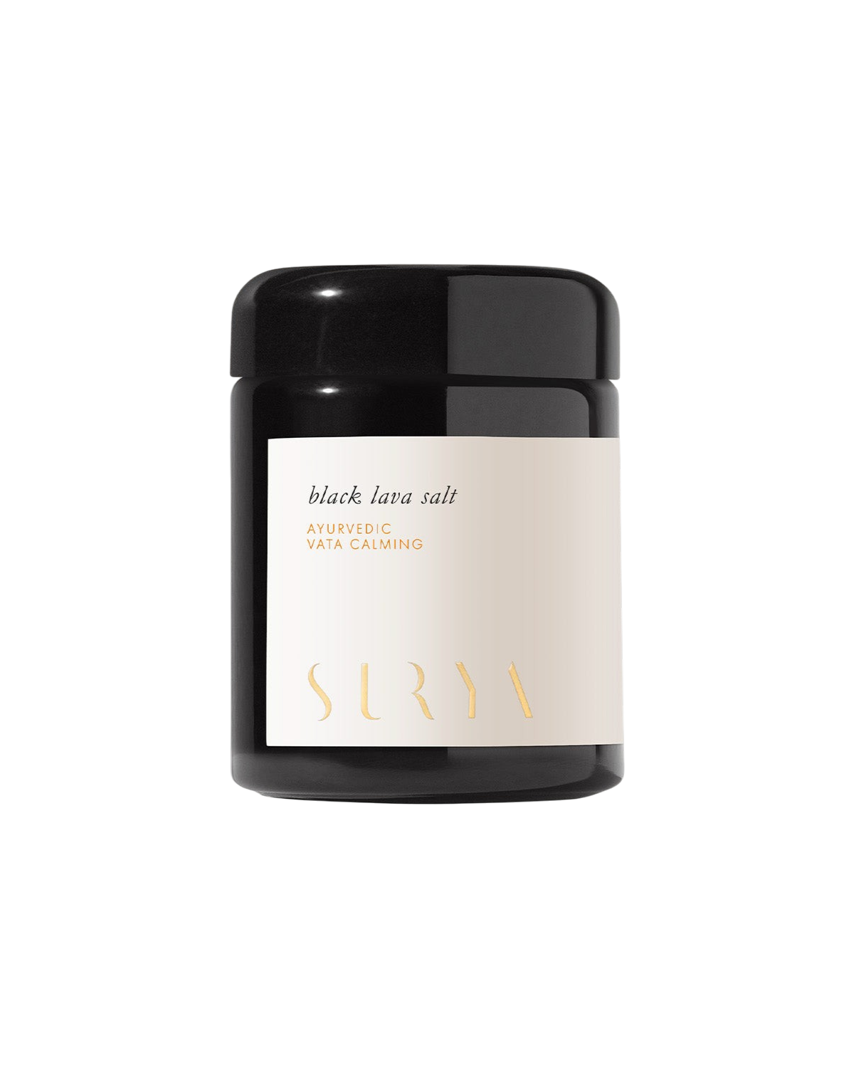 A black jar with a white label featuring "Black Lava Salt," "Ayurvedic salt," "Vata Calming," and the Surya brand name in gold, set against a plain, light background.
