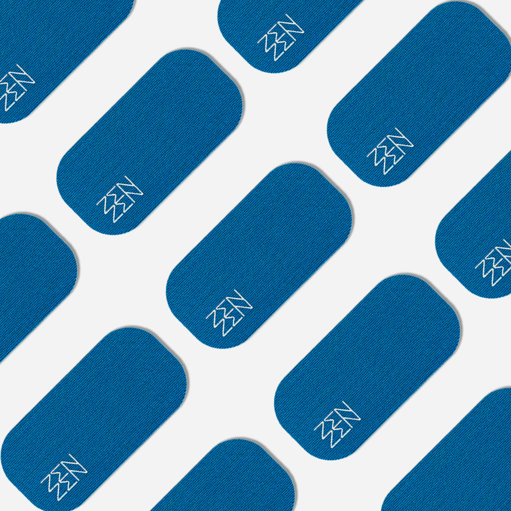 A diagonal pattern of blue Pacific Breeze Mouthtape patches by Zenzentape, each with rounded corners and a white zigzag logo, set on a light background. The design evokes the softness of organic bamboo silk.