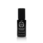 A black bottle with a black cap labeled "Daughter Alchemy Calm Ground® Botanical Calming Oil" and "0.3 FL OZ / 15 ML," featuring a white decorative logo, sits against a white background—this oil is formulated to calm anxiety.