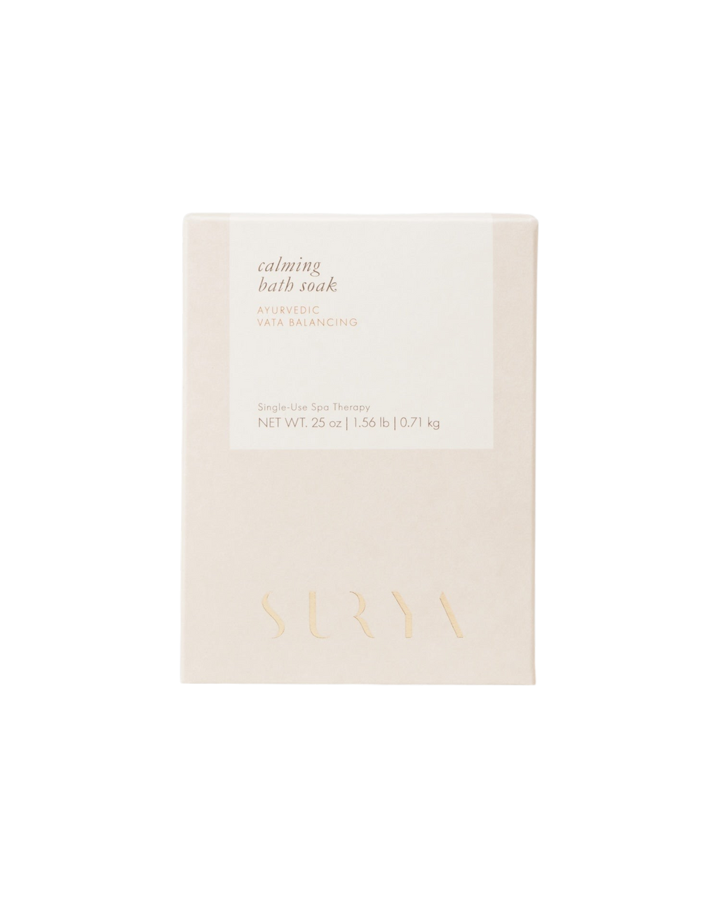 A beige 25 oz box labeled “Calming Bath Soak” by Surya features “Ayurvedic Vata Balancing,” is enriched with Ashwagandha, displays “Single Use Spa Therapy,” and has the brand name embossed at the bottom.