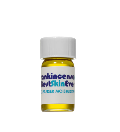 A small bottle of Living Libations skincare product with a white cap. The label on the bottle reads "Best Skin Ever Cleanser- Frankincense" in bold letters, highlighting it as a cleanser, exfoliator, and moisturizer. Infused with Frankincense Oil for acne redness soothing, the liquid inside is a vibrant yellow.