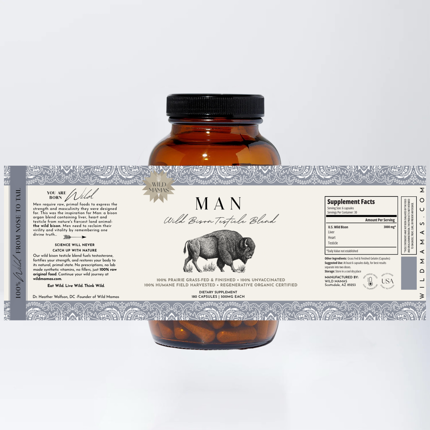 Amber bottle labeled "Wild Mamas Man - Wild Bison Testicle Organ Blend" featuring a bison graphic, supplement facts, whole food nutrition ingredients, and product details against a decorative gray and white background. Capsules are seen inside.