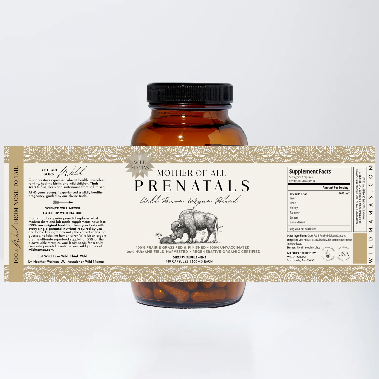 Amber bottle of Wild Mamas Mother of All Prenatals organ meat supplement with a beige label showing a bison illustration, product info, and supplement facts. Capsules from this grass-fed beef supplement are visible inside the bottle.