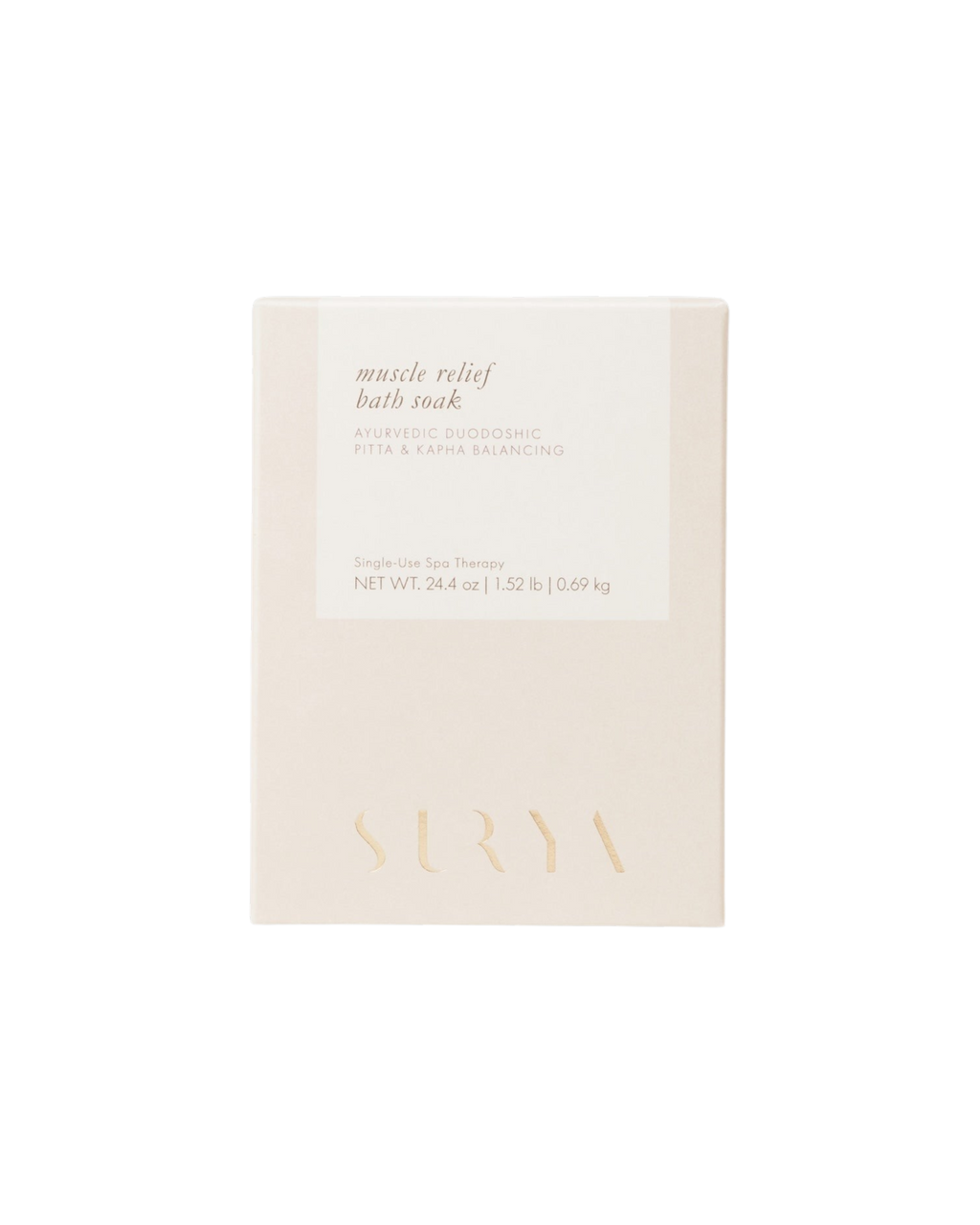 Minimalist beige and white box labeled "Muscle Relief Bath Soak" by Surya, featuring arnica montana for anti-inflammatory support, Ayurvedic doshic balancing, single-use spa therapy, and net weight 24.4 oz (0.69 kg).