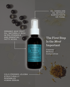 A bottle of Summer Solace Tallow’s Première Cleansing Oil is centered among acai berries, oil drops, and dried flowers. Text notes acai and jojoba oil benefits and how the product gently removes makeup, sunscreen, and buildup while cleansing skin.