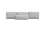 Three plain, square, light beige EcoWool pillows are arranged in a row, with a smaller, textured Shepherd's Dream Wool Lumbar Pillow in front. The background is white.