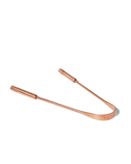 The Surya Copper Tongue Scraper, designed for Ayurvedic wellness, features two straight handles and a curved edge. Displayed on a white background.