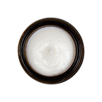 A small jar of Triple Mint Enamelizer Toothpaste from Living Libations highlights its organic ingredients, which include nano-hydroxyapatite, coconut oil, spearmint, and essential oils of tea tree and thyme.