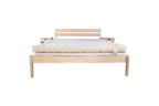 A minimalist wooden bed frame with a slatted headboard is topped with the All Wool Mattress by Shepherd's Dream, featuring a thick, cream-colored natural surface; two small wooden nightstands are placed behind the headboard.