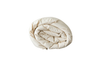 The Ashland Organic Wool Comforter from Shepherd's Dream, neatly rolled up and GOTS-certified, rests against a plain white background, providing thermoregulating warmth and comfort.