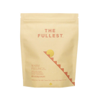 THE FULLEST’s Warm Feelings 30-Day Supply comes in a beige resealable pouch. The minimalist sun and staircase design reflect its mood-supporting, caffeine-free saffron formula—perfect for a calming daily latte ritual.